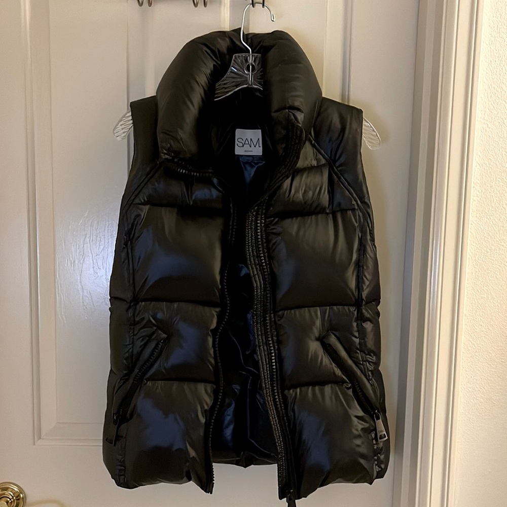SAM black down puffer vest. Size large but could fit a medium